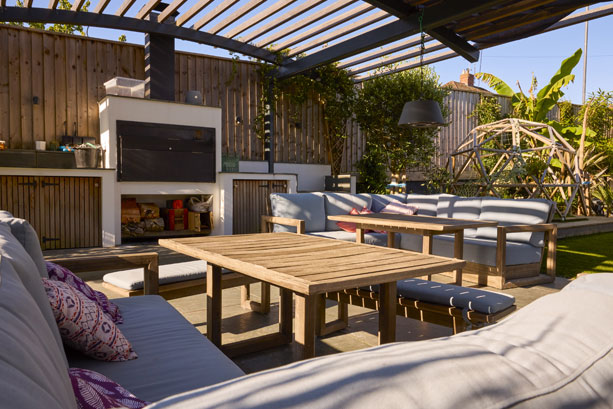 Modern alfresco with architectural windows and retractable blinds