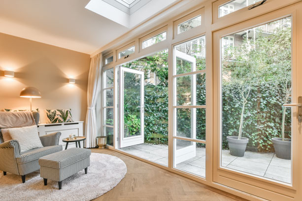 Modern alfresco with architectural windows and retractable blinds